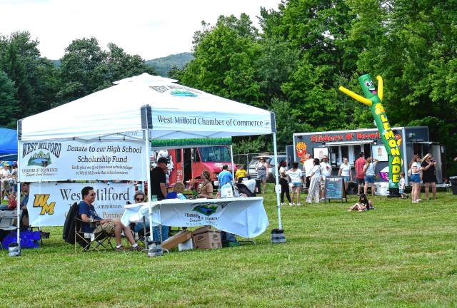 Crowd enjoys food, music, fun The West Milford Chamber of Commerce offers information.