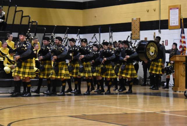 The Celtic Friars Pipe Band from St. Anthony’s High School in South Huntington, Long Island, enters the gym.
