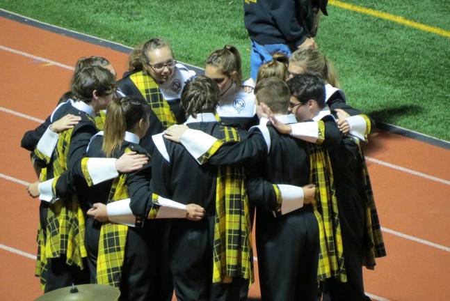 Highlander Marching Band wins State Championship Band members huddle before taking to the field in the Mount Olive competition.