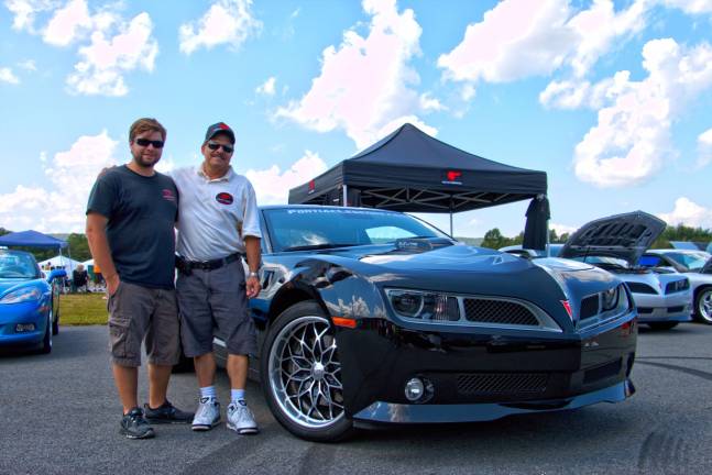 Ron Scalice, right, with his 2010 Pontiac Trans Am, took &quot;Best in Show&quot; at the car show Sunday. With him is his son Mike Scalice.