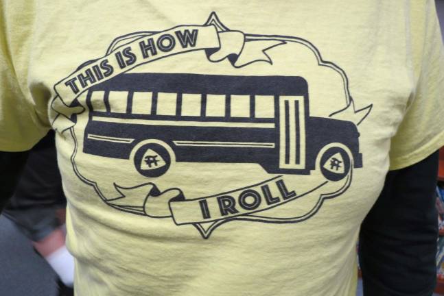 School bus drivers oppose transportation outsourcing A T-shirt wore by school bus drivers who oppose a proposal to outsource transportation services.