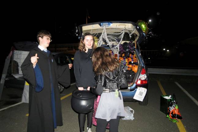'Spooktacular' fundraiser a gargantuan success "Harry Potter" helps hand out the Halloween treats. Photo by patricia keller