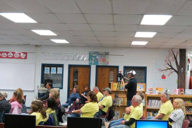 West Milford school bus drivers protest a proposal to outsource transportation services. They wore yellow T-shirts with the slogan, &quot;This is how I roll.&quot;