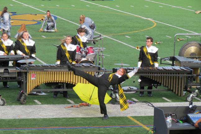 Highlander Marching Band wins State Championship A member of the West Milford Highlander Marching Band shows some fancy moves at the Pequannock competition.