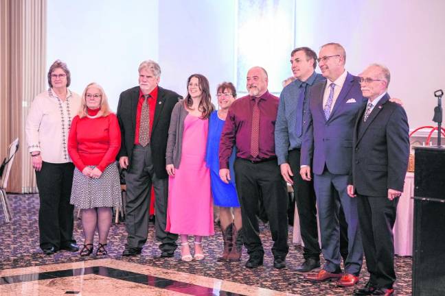 New officers of the West Milford First Aid Squad were sworn in by Mayor Michele Dale at the installation dinner dance Feb. 10 at Casa Bianca. From left are trustees Pat Burns, Stacy Aldrich and Ken Cuneo; recording secretary Cameron Burke; treasurer Sue Pappas; Lt. Tony Stevens; Capt. Andrew Wood; vice president Richard Lindstrom; and president Rob Jirouschek. Not present was corresponding secretary Gretchen Longaker. (Photo by James Seward)