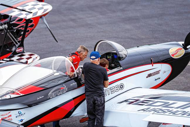 NJ Airshow plans return this fall Ken Rieder of Redline Airshows shows a young fan the cockpit of his plane Sunday, June 15. (Photo by TJ Nolan)
