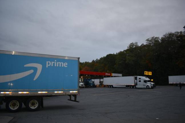 Big-box country Trucks at a gas station/truck stop in Newburgh, a couple miles from the county’s first million-square-foot warehouse: an Amazon fulfillment center built in 2021 in Montgomery.