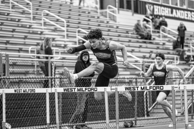 Lowenstein 10th in state Lorenzo Andrade leaps over a hurdle April 21.