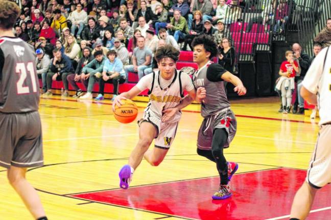 West Milford’s Tyler Liguori dribbles the ball while covered by High Point’s Jacob Guinta. Liquori scored 10 points.