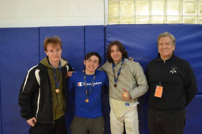 FN2 From left are senior Athan Burke, sophomore Kevin Docwra, senior Aidan Longacre and Coach David Gerold.