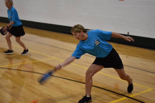 Sandy Hefferon sets for a return volley during the pickleball tournament.