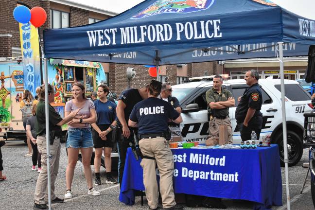 Community gathers for National Night Out The West Milford Police Department gives away plush bears.