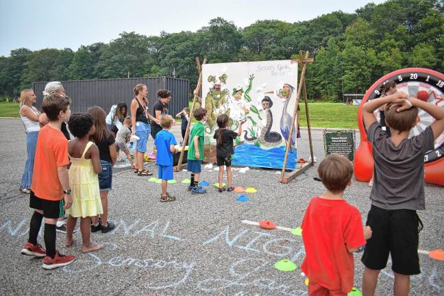 Community gathers for National Night Out The cream pie toss was one of the games.