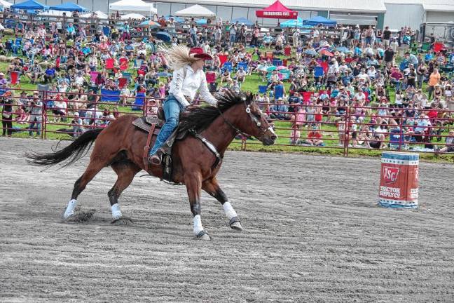 Rodeo is Saturday at Green Valley Farms Rodeo competitor Brittany Hill maneuvers her horse during the barrel race contest. Hill is a graduate of High Point Regional High School, where she was a standout basketball player.