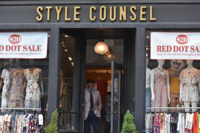 Bob Maxwell, co-owner of Style Counsel in Warwick, N.Y., which has been doing brisk business since retail stores were allowed to reopen with safety measures. (He took his mask off momentarily for the photo.) (Photo by Becca Tucker)