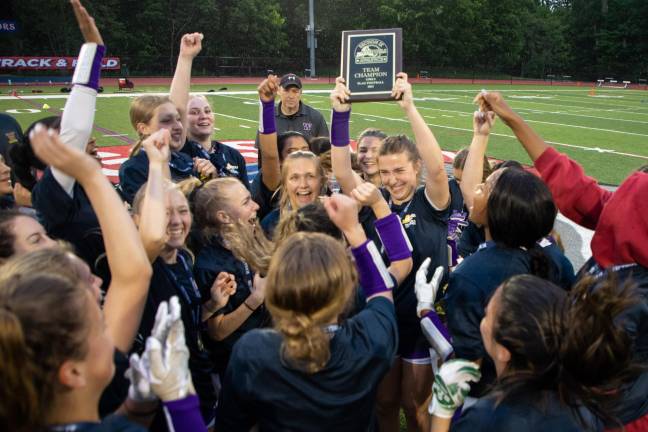 Girls on the field, ice, mat Members of the 2023 Warwick Valley High School girls’ flag football team celebrate winning the section championship. (Photo provided by the Warwick Valley School District)