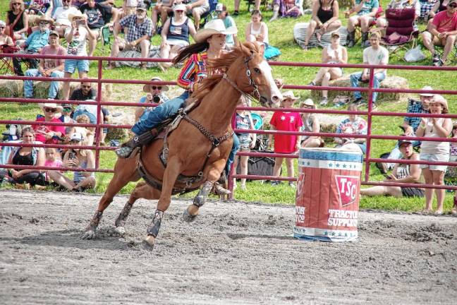 Rodeo is Saturday at Green Valley Farms Rodeo competitor Autumn Weiss of Rockaway rides her horse during the barrel race contest.