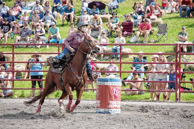 Rodeo is Saturday at Green Valley Farms Rodeo competitor Maddy Helm of Eagleville, Tenn., rides her horse during the barrel race event.