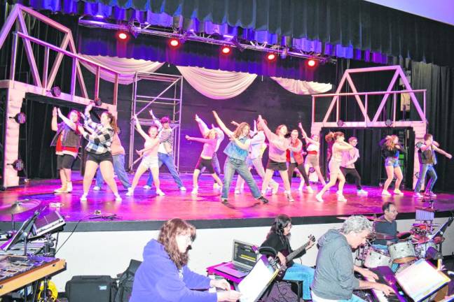 The cast of ‘Footloose’ rehearses Saturday, March 2 in the West Milford High School auditorium.