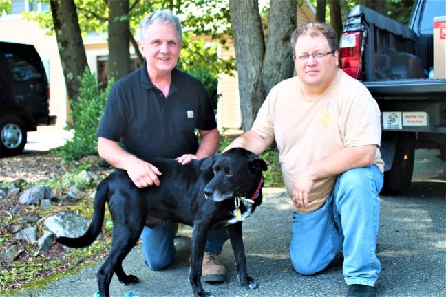 'Life of Riley:' Viral video of bear chasing dog brings limelight to Hewitt West Milford. The recent vrial video of local dog Riley chasing a black bear away gave neighbors in Hewitt a good amount of attention. Dog owner Alan Tlusty and neighbor Mark Stinziano with the hero, Riley. garrett hemmerich photos