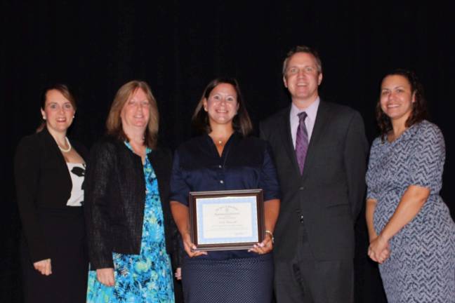 At the awards ceremony were, from left: Kimberley Harrington, state education commissioner; Brenda Ludwig, West Milford foreign language supervisor and the governor's Educator of the Year program coordinator; honoree Nicole Petrosillo; Principal Paul Gorski, and Alma Morel, Passaic County education specialist.