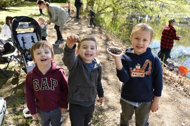 From left, Landon Weiss, 3; Cason Brandt, 3; and Cameron Brandt, 6, had great fun with the worms.