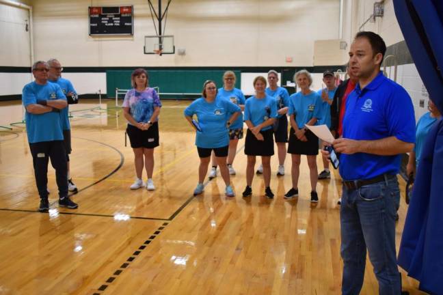 Community Services &amp; Recreation director Dan Kochakji addresses participants in the pickleball “Battle of the Paddle” tournament Saturday.