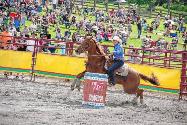 Rodeo is Saturday at Green Valley Farms Rodeo competitor Bobbie Jo Griswold of Lake Luzerne, N.Y., maneuvers her horse during the barrel race contest.