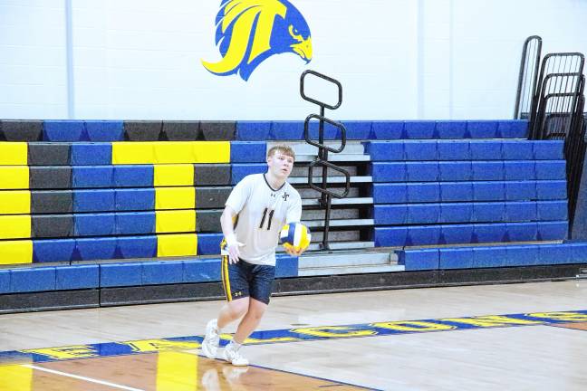 Sports roundup: Shatzel wins 3 gold medals Jefferson's Andrew Mohlenhoff is in the midst of a serve.