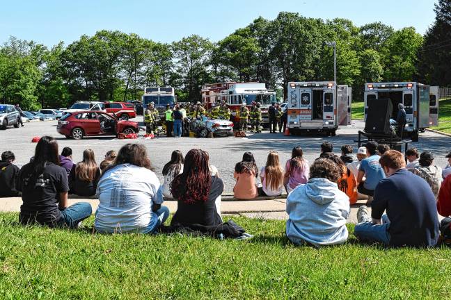 Simulated crash meant as warning Students watch the first-responders at work.