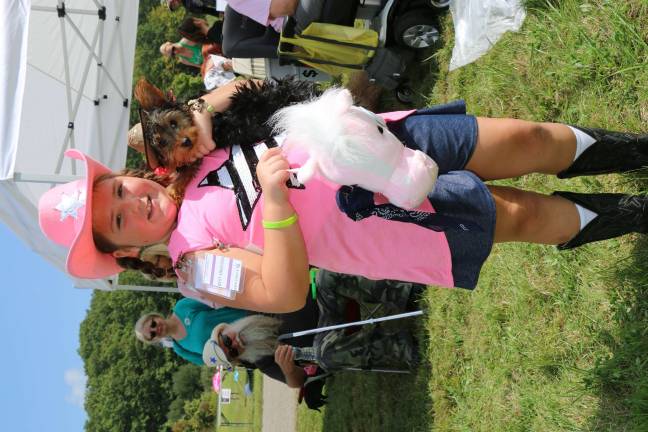 Pooches strut their stuff in Walk-a-Dog-athon Haylie Rocco's Jaxson took home a second place prize for the smallest doggie. The pals also snagged an honorable mention in the best-dressed category.