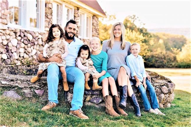 Alyssia and Josh Arnau with their children and step children.