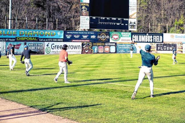 Athletes warm up by playing catch before taking part in open tryouts for the Sussex County Miners on April 26 at Skylands Stadium in Augusta. (Photos by Jay Vogel)