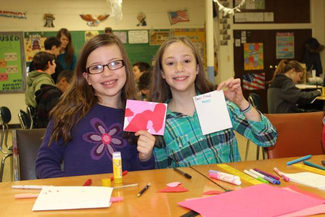 Students, teachers show the 'heart' of Ringwood Christian School Hailey and Rachel show some of the cards they made for the residents at Wanaque Center.