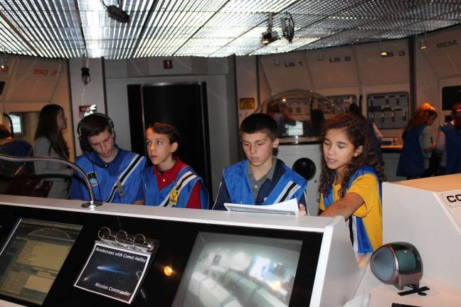 Escape Day from classes brings fun and learning The Communications team worked with the spacecraft and mission control during Ringwood Christian School's Escape Day at the Buehler Challenger and Science Center.