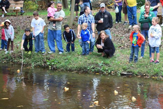 It was smooth sailing for the ducks Cheering on thier rubber duckies. Photo by Ginny Raue