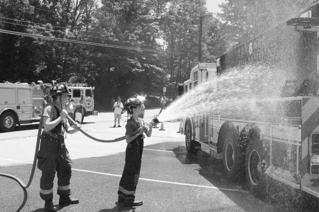 Community commissions Tanker 6 Tanker 6 gets hosed. Photo by Ginny Raue