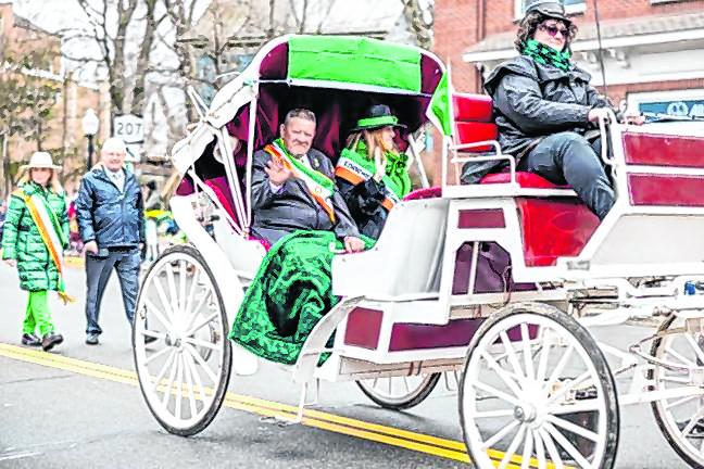 Grand marshal Unateresa Sheahan Gormley and her husband, Sam Gormley, ride in the Mid Hudson St. Patrick’s Day Parade in Goshen, N.Y., on March 10. She is a first-generation Irish American and owner of the Sheahan-Gormley School of Irish Dance in Greenwood Lake. (Photo by Sammie Finch)