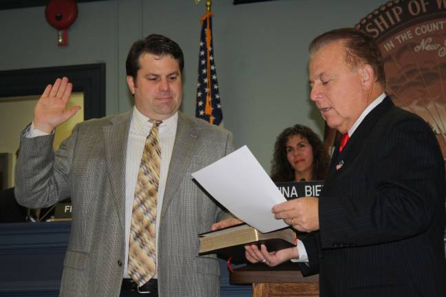 I do solemnly swear... State Senator Joseph Pennacchio, right, swears in Councilman Mike Hensley. This is Hensley's second term in office.