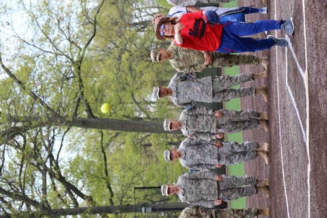 Photos by Don Web West Milford VFW Chaplain Sharon Einbinder throws out the first pitch at the Seton hall university softball game against Butler last Saturday.