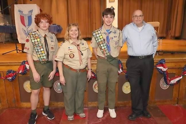 New Eagle Scout David Braen, second from right, with his parents and brother.