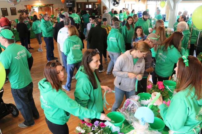 Photos by Don Webb of Spider Webb Photography Many who walked wore their green for the Irish Whisper Walk. The group also raised money by selling merchandise and hosting a tricky tray.