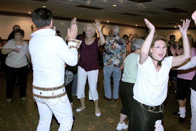Back to the 50s at the hop "Elvis" kept the folks on the dance floor all night.