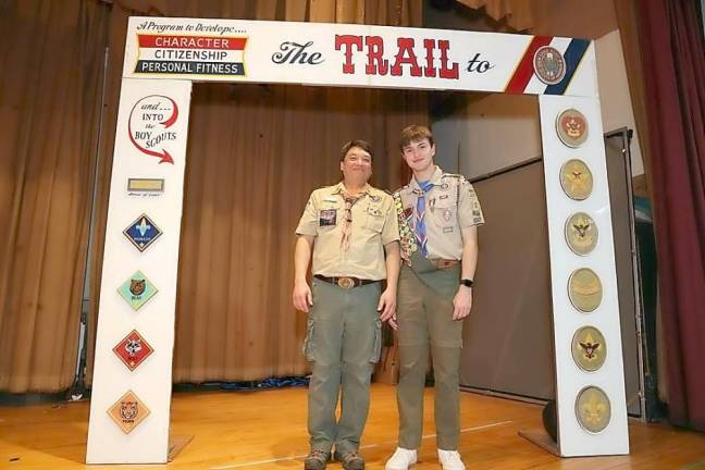 David Braen, with Scoutmaster Lee Szolusha under “the Eagle arch,” where the Eagle Scout ceremony took place.