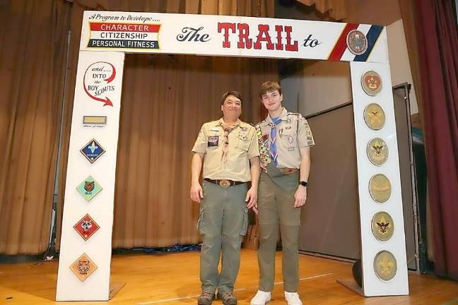 David Braen, with Scoutmaster Lee Szolusha under “the Eagle arch,” where the Eagle Scout ceremony took place.