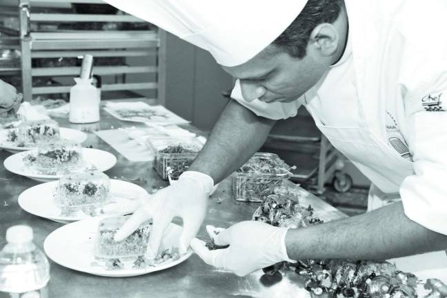 Winning meal from a hospital Saint Clares culinary pros get bronze medal in national competition Saint Clare’s Executive Chef Aatul Jain preparing the winning dish at the Association for Healthcare Foodservice Culinary Competition in Miami.