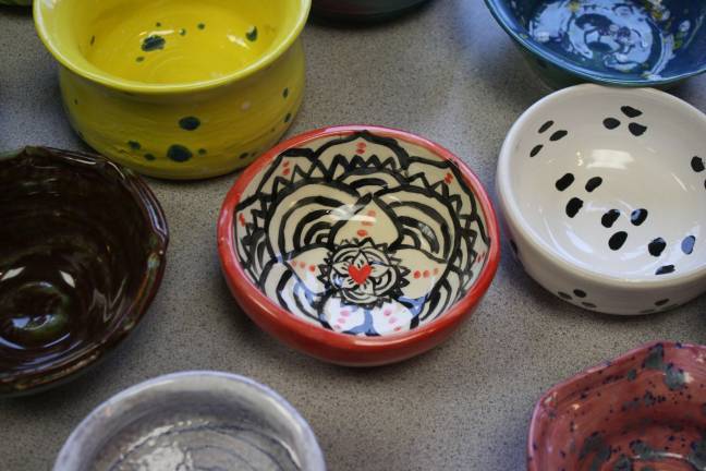 The giving was plentiful Photos by Kyle Hancharick These are some of the beautiful pottery bowls made by the art students at West Milford High School for the Empty Bowls fund raiser.