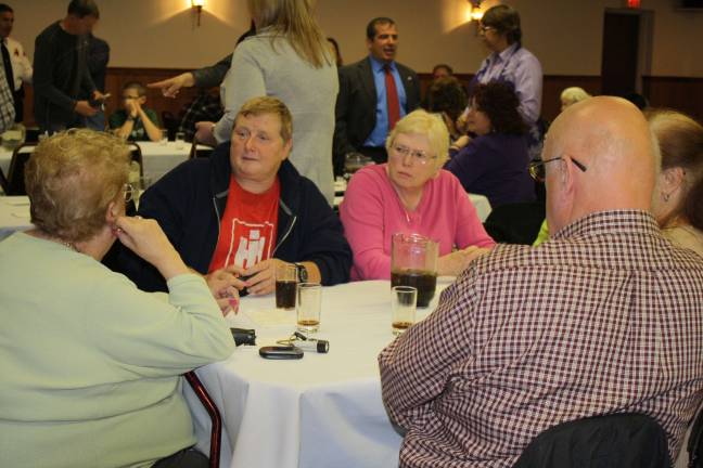 C.A.S.A. opens some eyes Councilwoman Ada Erik, in red, talks to former school board president Midge Touw at the C.A.S.A. dinner.