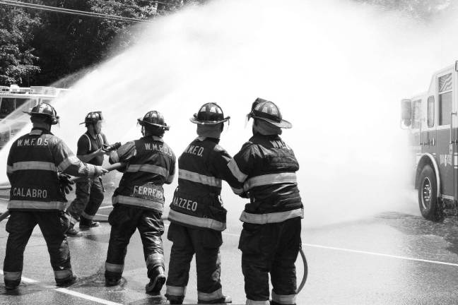 Community commissions Tanker 6 A wall of water from Upper Greenwood Lake Vol. Fire Co. #5. Photo by Ginny Raue