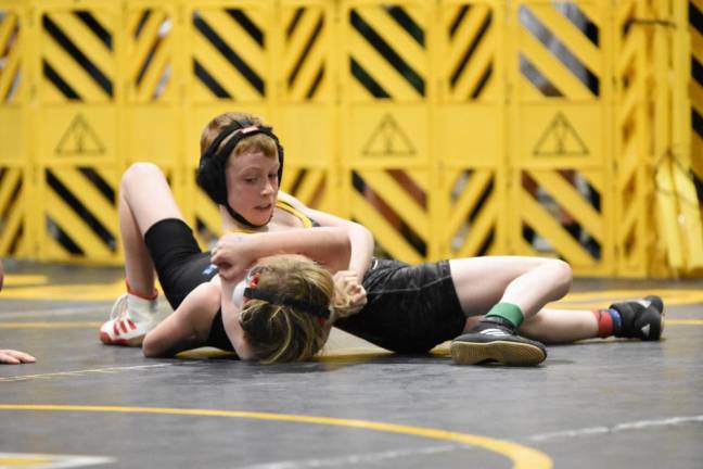 WMJW’s Gavin DeLoughery pins his opponent.